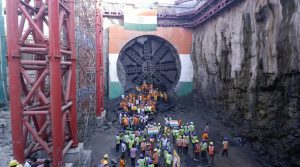 Workers and officials cheer after the breakthrough of the second tunnel Tuesday. Pradip Das