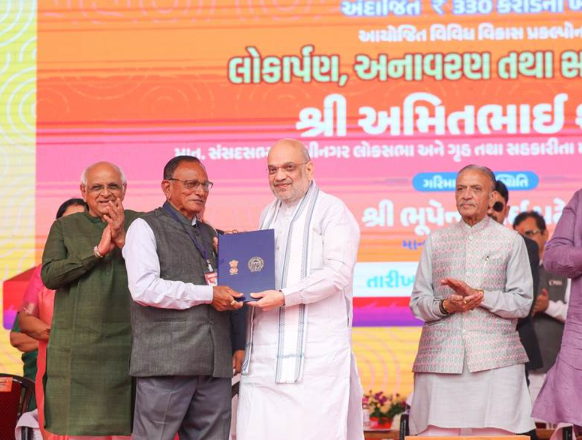 Amit Shah Distributes Land Allotment Certificates to 205 Displaced Families in Ahmedabad, Reinforces Modi Government’s Commitment to Public Servicea